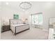 Inviting bedroom with neutral tones, bay window nook, walk in closet, and a decorative chandelier at 6831 Conservatory Ln, Charlotte, NC 28210