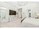 Spacious main bedroom with French doors, decorative dresser, and a generous walk-in closet for ample storage at 6831 Conservatory Ln, Charlotte, NC 28210