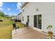 Backyard with a patio, two chairs, and a view of the grass and fence line at 703 Pointe Andrews Dr, Concord, NC 28025