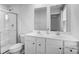 Bright bathroom with dual sinks, framed mirrors and a glass enclosed shower at 703 Pointe Andrews Dr, Concord, NC 28025