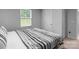 Bright bedroom with a queen bed, window, and neutral color palette at 703 Pointe Andrews Dr, Concord, NC 28025
