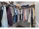 Walk-in closet with shelving for clothing and ample storage at 703 Pointe Andrews Dr, Concord, NC 28025