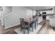 Cozy dining area with seating for four, adjacent to the kitchen with stainless steel appliances and granite countertops at 703 Pointe Andrews Dr, Concord, NC 28025