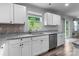Well-lit kitchen featuring granite countertops, stainless steel appliances and modern cabinetry at 703 Pointe Andrews Dr, Concord, NC 28025