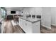 Open concept living area with kitchen island, dining table, and cozy seating area at 703 Pointe Andrews Dr, Concord, NC 28025