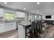 Open concept living area with kitchen island, dining table, and cozy seating area at 703 Pointe Andrews Dr, Concord, NC 28025