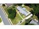 Aerial view of a landscaped property featuring a home with a grey roof and large yard at 7101 City View Dr, Charlotte, NC 28212