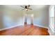 Bedroom featuring hardwood floors, ceiling fan, closets and a view to an adjacent room at 7101 City View Dr, Charlotte, NC 28212