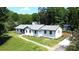 Charming single-story home with fresh exterior paint, mature trees, and spacious yard at 7101 City View Dr, Charlotte, NC 28212