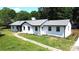 Charming single-story home with fresh exterior paint, walkway, and mature landscaping at 7101 City View Dr, Charlotte, NC 28212