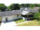 Ranch style home with an attached garage and an enclosed front porch at 7101 City View Dr, Charlotte, NC 28212