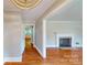 Spacious living room featuring hardwood floors, a fireplace, and a seamless open floor plan at 7101 City View Dr, Charlotte, NC 28212