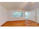 Cozy living room featuring hardwood floors and a bright window for natural light at 7101 City View Dr, Charlotte, NC 28212