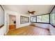 Inviting sunroom with brick accents, a ceiling fan, and large windows for natural light at 7101 City View Dr, Charlotte, NC 28212