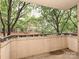 Outdoor balcony area with views of lush greenery and brick buildings at 718 W Trade St, Charlotte, NC 28202