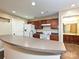 Kitchen with a breakfast bar, white appliances, and dark cabinetry at 718 W Trade St, Charlotte, NC 28202