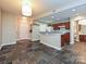 Open floor plan features an eat-in kitchen with cherry cabinets and white appliances at 718 W Trade St, Charlotte, NC 28202