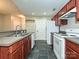 Kitchen featuring dark cabinets, stainless steel appliances, and a breakfast bar at 718 W Trade St, Charlotte, NC 28202