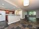 Open floor plan with a fireplace, large windows, and modern finishes, perfect for entertaining at 718 W Trade St, Charlotte, NC 28202