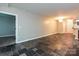 Spacious living room area featuring the unit's open floorplan and unique flooring at 718 W Trade St, Charlotte, NC 28202