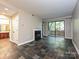 Spacious living area with a fireplace and a sliding door to a balcony, providing natural light at 718 W Trade St, Charlotte, NC 28202