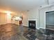 Living area showcasing the open layout, fireplace, kitchen access, and bedroom entrance at 718 W Trade St, Charlotte, NC 28202