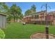 Spacious backyard featuring a deck, lush lawn, and mature trees, perfect for outdoor activities at 7312 Barcliff Dr, Charlotte, NC 28212