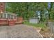 Private backyard featuring a deck and patio, perfect for outdoor entertaining at 7312 Barcliff Dr, Charlotte, NC 28212