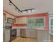 Bright kitchen featuring modern appliances, granite countertops, and track lighting at 7312 Barcliff Dr, Charlotte, NC 28212
