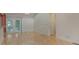 Bright living area features hardwood floors and leads to a patio through sliding glass doors at 7312 Barcliff Dr, Charlotte, NC 28212