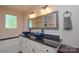 Bathroom features double sink vanity with bowl sinks and neutral paint at 8024 Eagle St, Mount Pleasant, NC 28124
