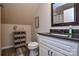 Comfortable bathroom with granite countertop, stylish mirror, and elegant accessories at 8024 Eagle St, Mount Pleasant, NC 28124