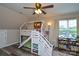 Bright bedroom features ceiling fan, bunk beds with slide, and large window at 8024 Eagle St, Mount Pleasant, NC 28124