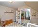 Bright Bedroom featuring a rug, rocker, changing table, and reflected closet at 8024 Eagle St, Mount Pleasant, NC 28124