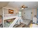 Comfortable bedroom featuring a bunk bed, ceiling fan, and natural light at 8024 Eagle St, Mount Pleasant, NC 28124
