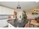 Kitchen island with granite countertops and seating that looks into a living room at 8024 Eagle St, Mount Pleasant, NC 28124