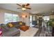 Open-concept living room with modern decor and view into the kitchen at 8024 Eagle St, Mount Pleasant, NC 28124
