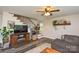 Comfortable living room features a TV and stylish shelving and decor at 8024 Eagle St, Mount Pleasant, NC 28124