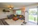 Inviting living room with plush sectional sofa, area rug, and lots of natural light at 8024 Eagle St, Mount Pleasant, NC 28124