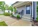 Cozy front porch with rocking chairs and neatly landscaped garden beds at 8024 Eagle St, Mount Pleasant, NC 28124