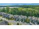 Aerial view of townhomes showcasing a well-maintained neighborhood with pond at 8031 Scarlet Oak Ter, Indian Land, SC 29707