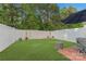 Private backyard featuring a well-maintained lawn, white fencing, and space for outdoor relaxation and entertaining at 8031 Scarlet Oak Ter, Indian Land, SC 29707