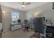 This bedroom is setup up for a home office with dual monitors and ceiling fan at 8031 Scarlet Oak Ter, Indian Land, SC 29707