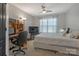Bright bedroom offers a ceiling fan and large window, providing natural light and comfort at 8031 Scarlet Oak Ter, Indian Land, SC 29707