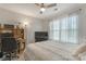Bright bedroom offers a ceiling fan and large window, providing natural light and comfort at 8031 Scarlet Oak Ter, Indian Land, SC 29707