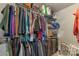 Walk-in closet features shelving, hanging rods and ample space for storage at 8031 Scarlet Oak Ter, Indian Land, SC 29707