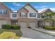 Inviting townhome showcasing manicured lawns, driveways leading to garages, and a pleasing facade on a sunny day at 8031 Scarlet Oak Ter, Indian Land, SC 29707