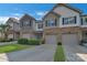 Charming townhome with manicured lawns, attached garages, and inviting curb appeal in a desirable neighborhood at 8031 Scarlet Oak Ter, Indian Land, SC 29707