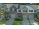 Charming townhome with manicured landscaping, attached garages, and inviting curb appeal in a desirable neighborhood at 8031 Scarlet Oak Ter, Indian Land, SC 29707