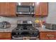 Kitchen with stainless steel appliances, granite countertops, and gas range at 8031 Scarlet Oak Ter, Indian Land, SC 29707
